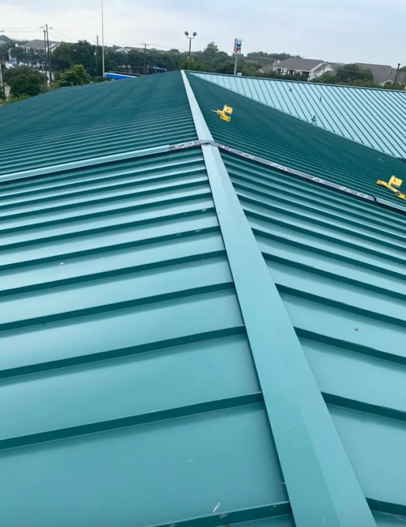 Green commercial metal roof ridge and valley for Metal Roof Repair in Shrewsbury